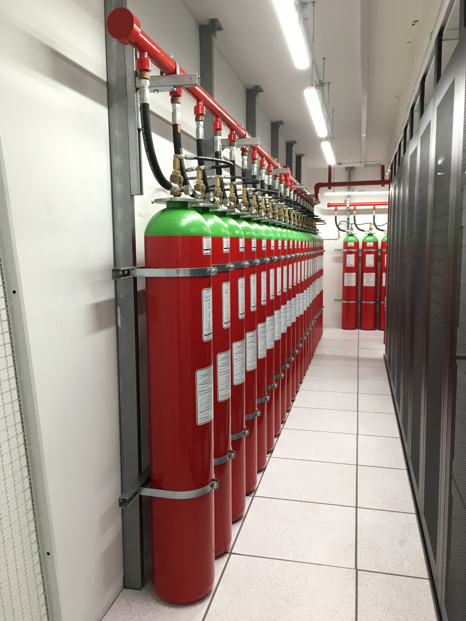 Installed Agnitar Inert Fire Suppression System – high-pressure inert gas cylinders in line installation.